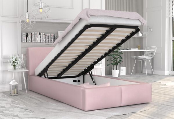 Różowe łóżko tapicerowane z podnoszonym stelażem i pojemnikiem