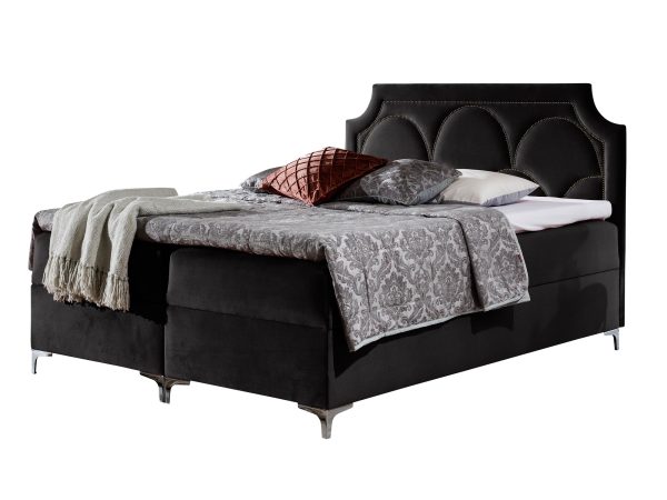 Czarne łóżko z wezgłowiem pikowanym w geometryczny wzór
