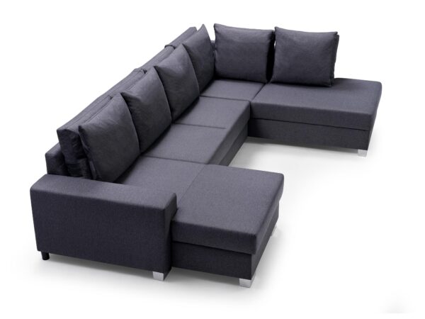 Narożnik modułowy z szarym szezlongiem i poduchami, styl minimalistyczny