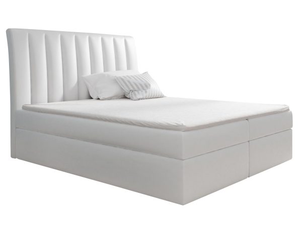 Białe łóżko z wysokim zagłówkiem i białym materacem