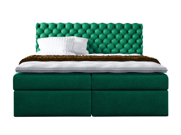 Zielone łóżko z dekoracyjnym wezgłowiem i elegancką podstawą