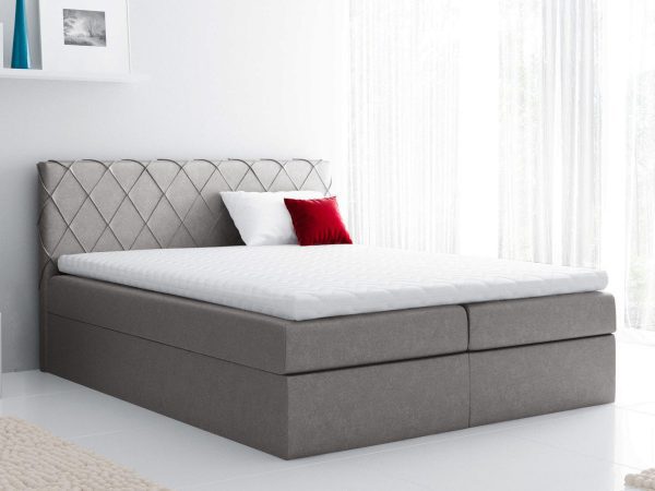 Szare łóżko z eleganckim pikowaniem i zagłówkiem do przytulnego wnętrza