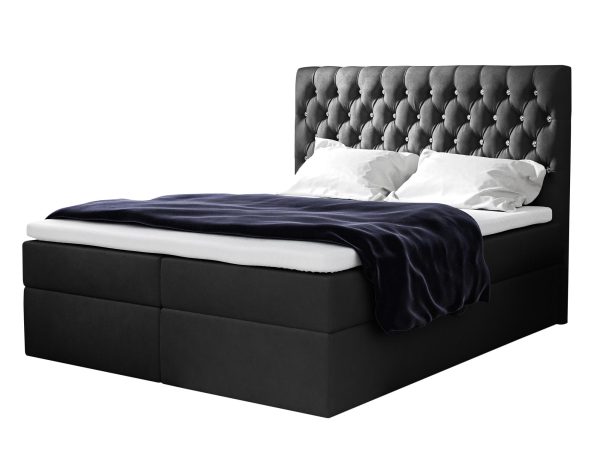 Czarne łóżko z przeszywanym zagłówkiem i kontrastową pościelą