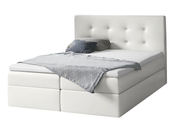 Białe łóżko z minimalistycznym designem i jednym jaśkiem