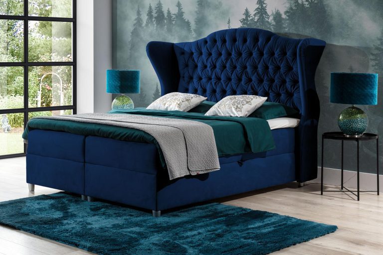 Granatowe łóżko kontynentalne z wysokim pikowanym zagłówkiem