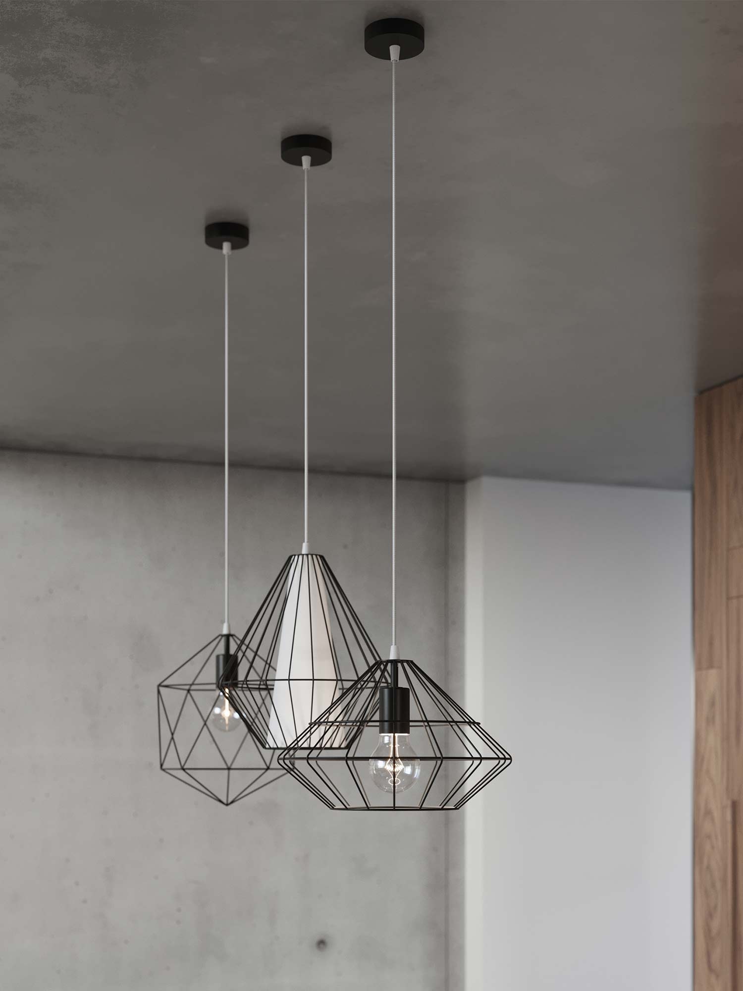 Wnętrze loftowe z trzema lampami wiszącymi – czarne klosze