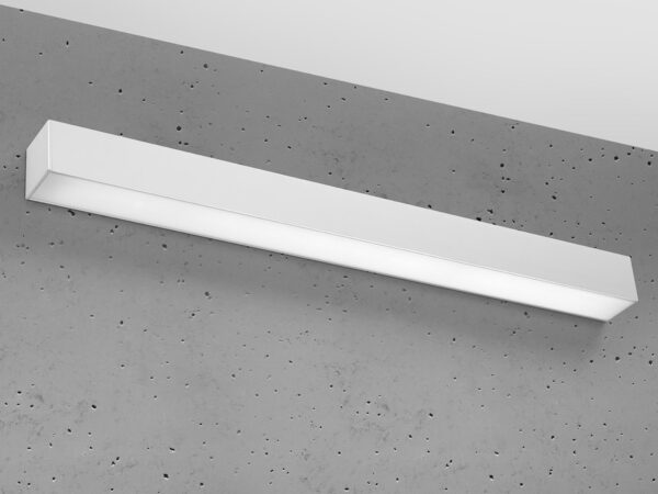 Smukła biała lampa LED zamontowana na suficie betonowym