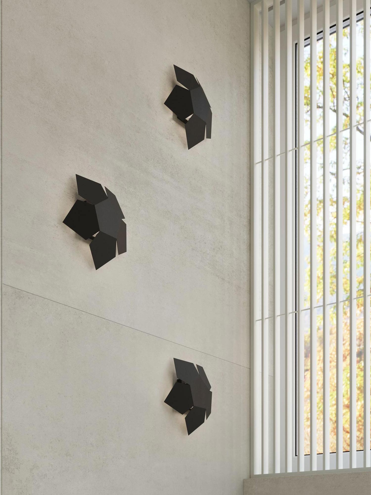 Trzy czarne lampy na ścianie – wystrój sypialni z betonu Trzy czarne lampy na ścianie – wystrój sypialni z betonu