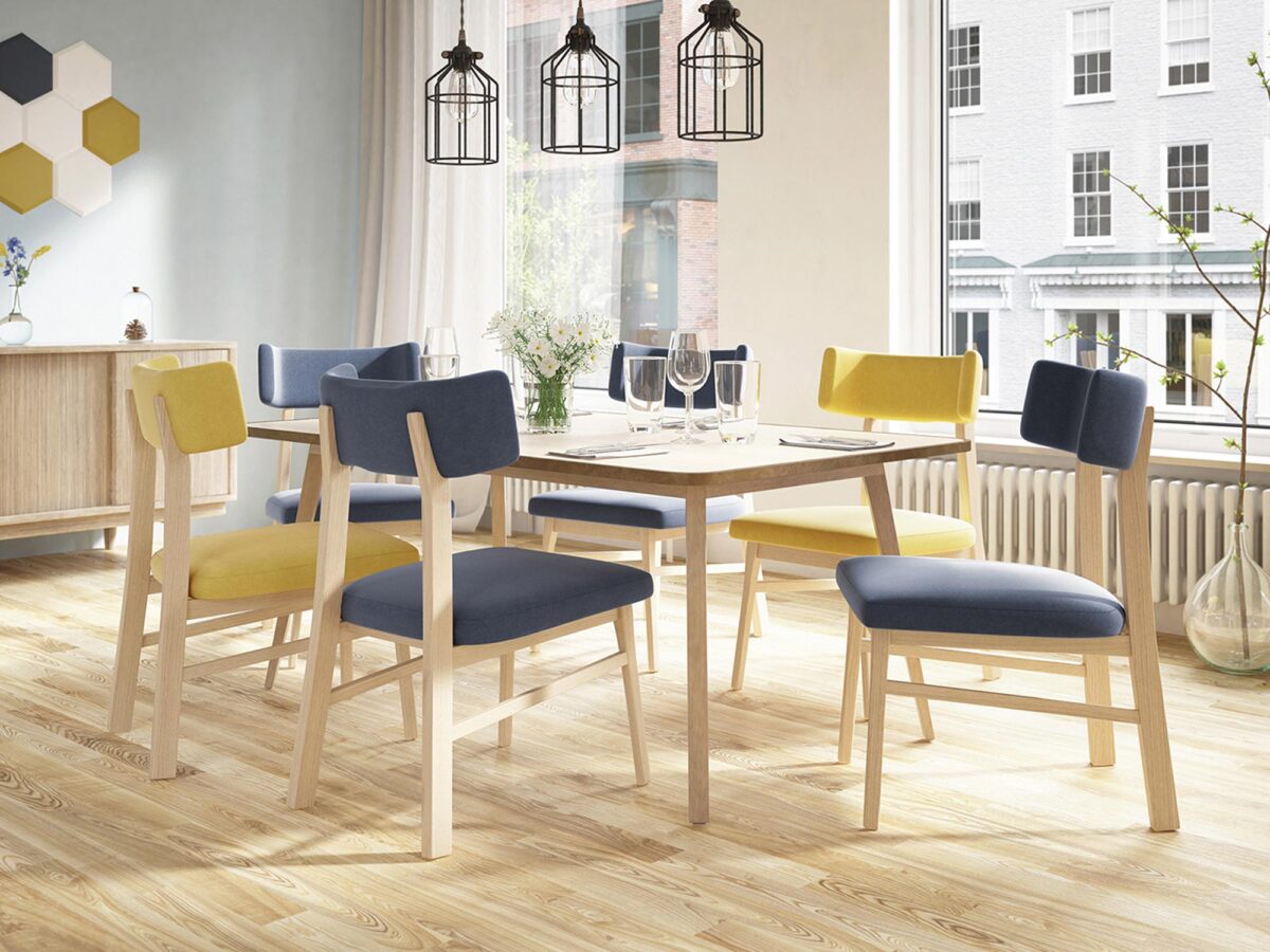 Kolorowa jadalnia ze stołem i krzesłami w stylu skandynawskim