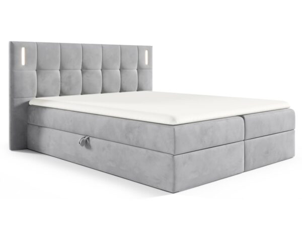 Jasnoszare łóżko z miękkim zagłówkiem i praktycznym podziałem w stylu skandynawskim