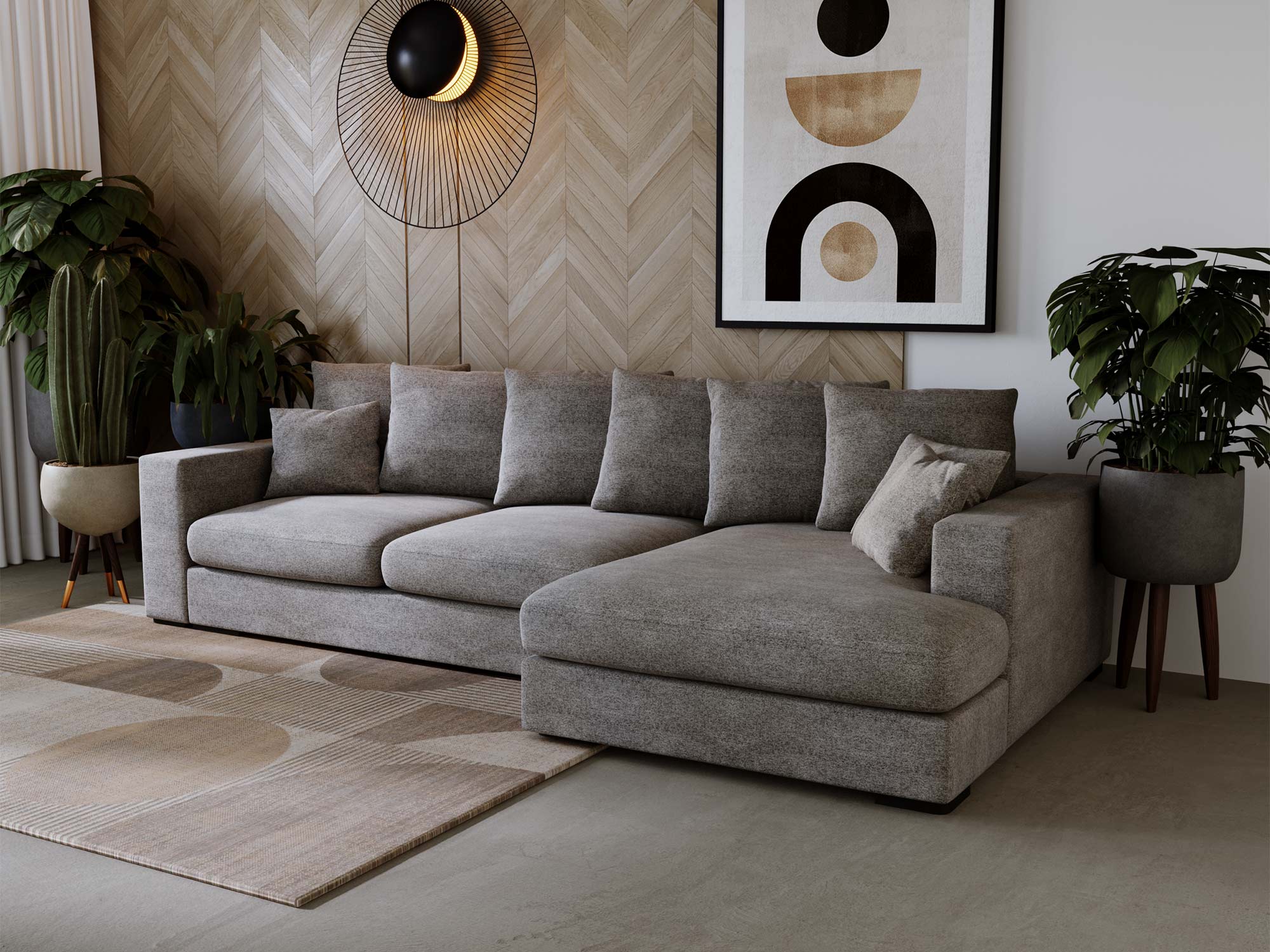 Ciemnoszara sofa narożna z dekoracją i rośliną w tle