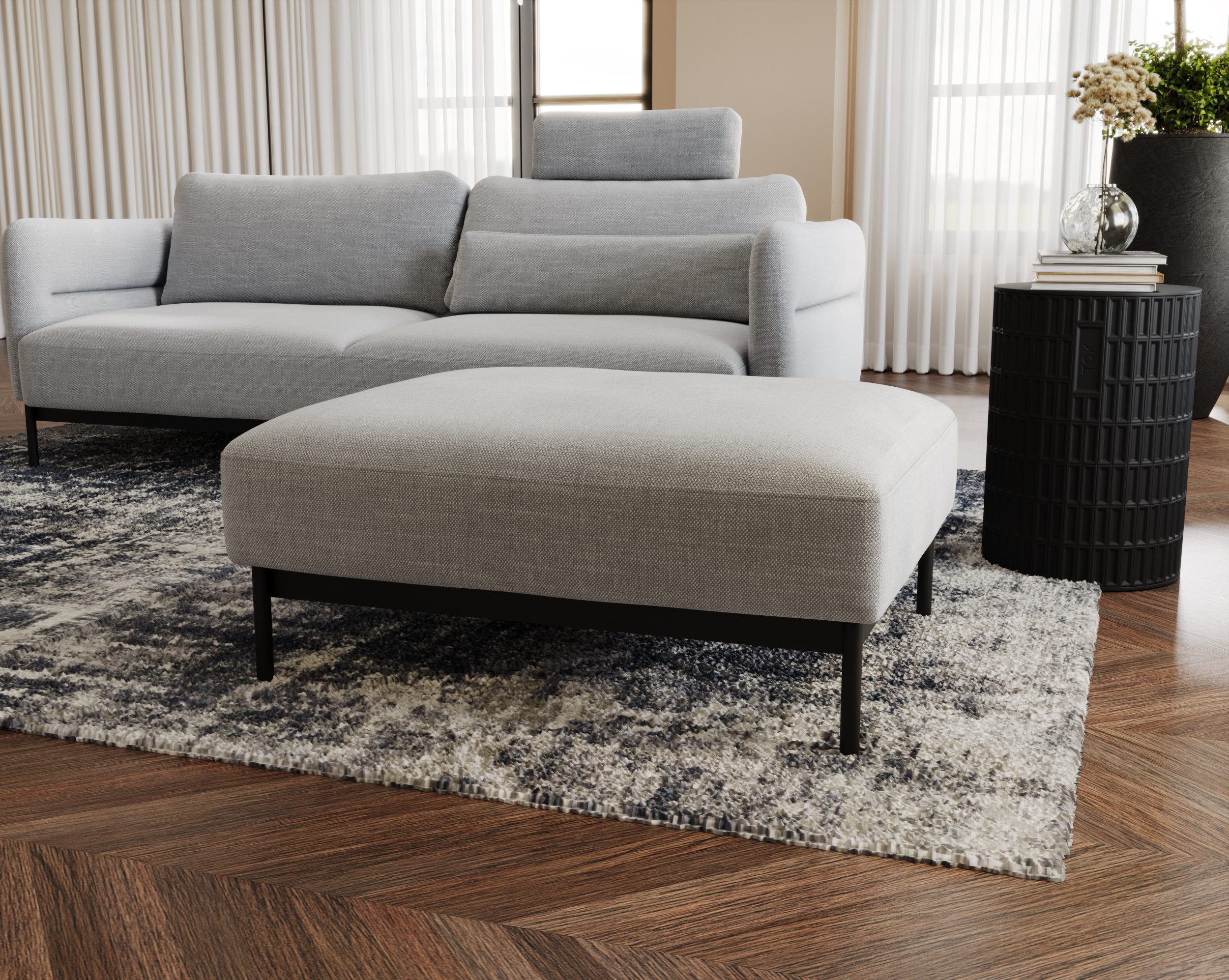 Szara pufa w stylu soft loft – tapicerowana, prostokątna forma