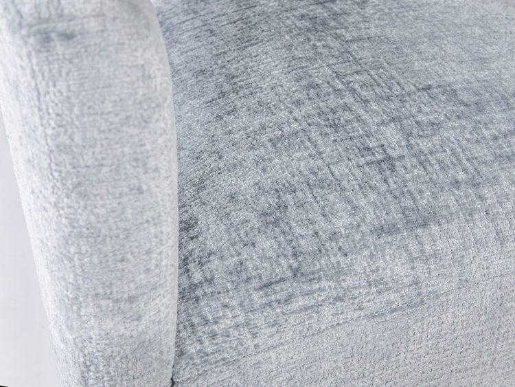 Detal tkaniny w odcieniu jasnoszarym o fakturze boucle